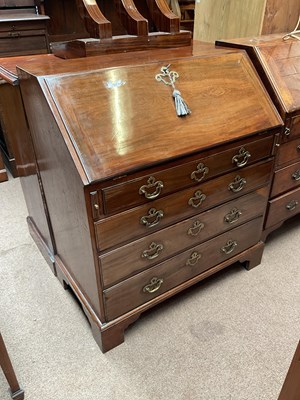 Lot 111 - A George III mahogany bureau, with fall...