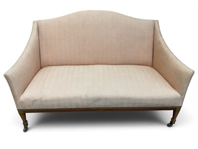 Lot 113 - An Edwardian mahogany salon sofa, with...