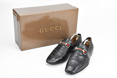 Lot 1445 - GUCCI; a pair of men's black grained calfskin...