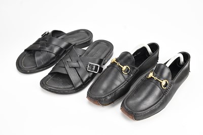 Lot 1444 - GUCCI; a pair of black calfskin leather men's...