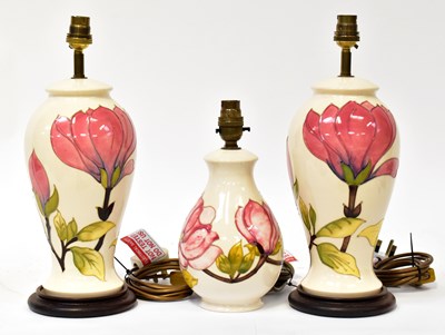 Lot 141 - MOORCROFT; three 'Magnolia' pattern table...