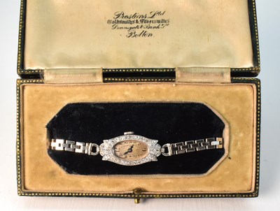 Lot 1029 - An Art Deco cocktail watch with oval silvered...