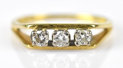 Lot 506 - An 18ct yellow gold diamond set three stone...