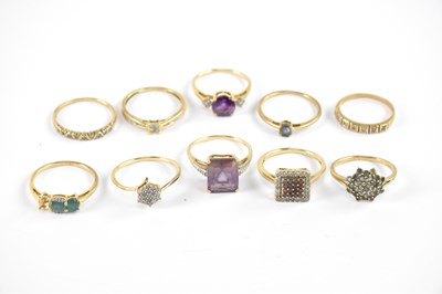 Lot 876 - Nine 10ct yellow gold rings set with gemstones,...