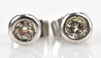 Lot 195 - A pair of 18ct white gold diamond ear studs,...