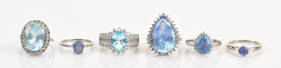 Lot 636 - Six decorative dress rings set with pale blue...