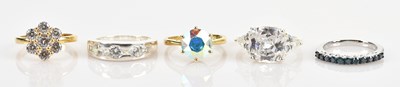 Lot 645 - Five sterling silver dress rings, sizes N, P...