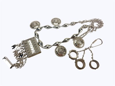 Lot 992 - An Indian silver ornate necklace together with...