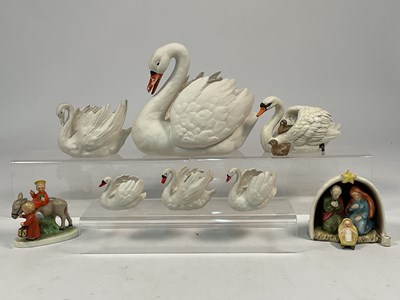 Lot 195 - GOEBEL; porcelain models of swans and cygnets,...