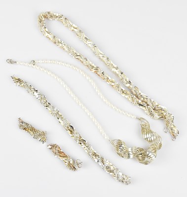 Lot 631 - A white metal filigree decorated suite of...