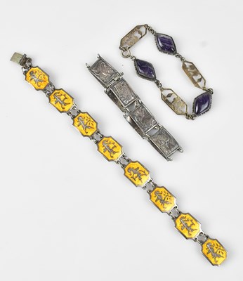 Lot 655 - Three white metal bracelets comprising an...