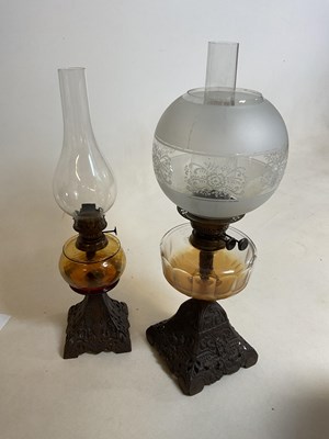 Lot 643 - Two late Victorian oil lamps, each with...