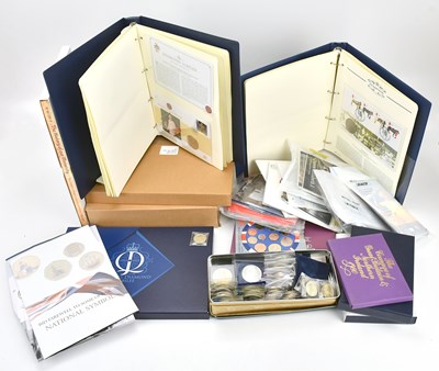 Lot 574 - A collection of commemorative coins and packs,...
