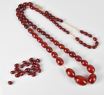 Lot 262 - A single strand cherry amber coloured beaded...