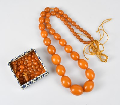 Lot 356 - A butterscotch amber coloured beaded necklace,...