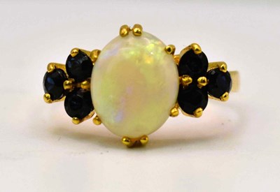 Lot 447 - A 21ct yellow gold, opal and dark blue spinel...