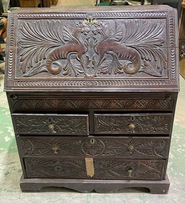 Lot 668 - A Victorian carved oak bureau, W110xH91xD44cm.