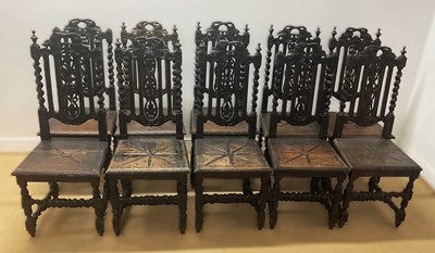 Lot 645 - Ten 19th century oak hall chairs with carved...