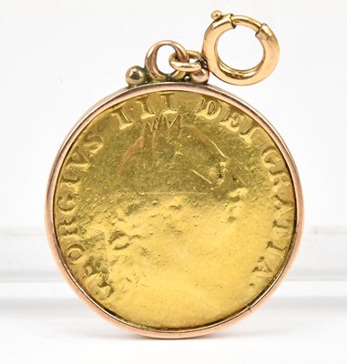 Lot 617 - A George III spade guinea, 1787, in yellow...