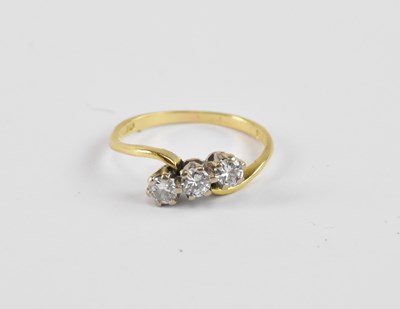 Lot 861 - An 18ct yellow gold ring set with three...