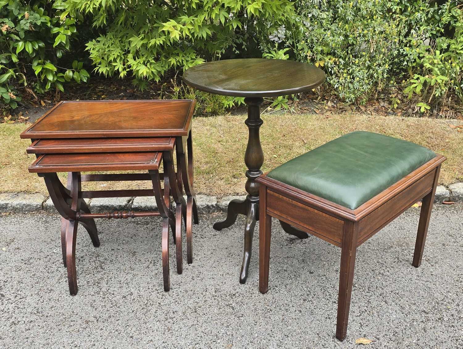 Lot 22 - A nest of three modern mahogany X-frame tables...
