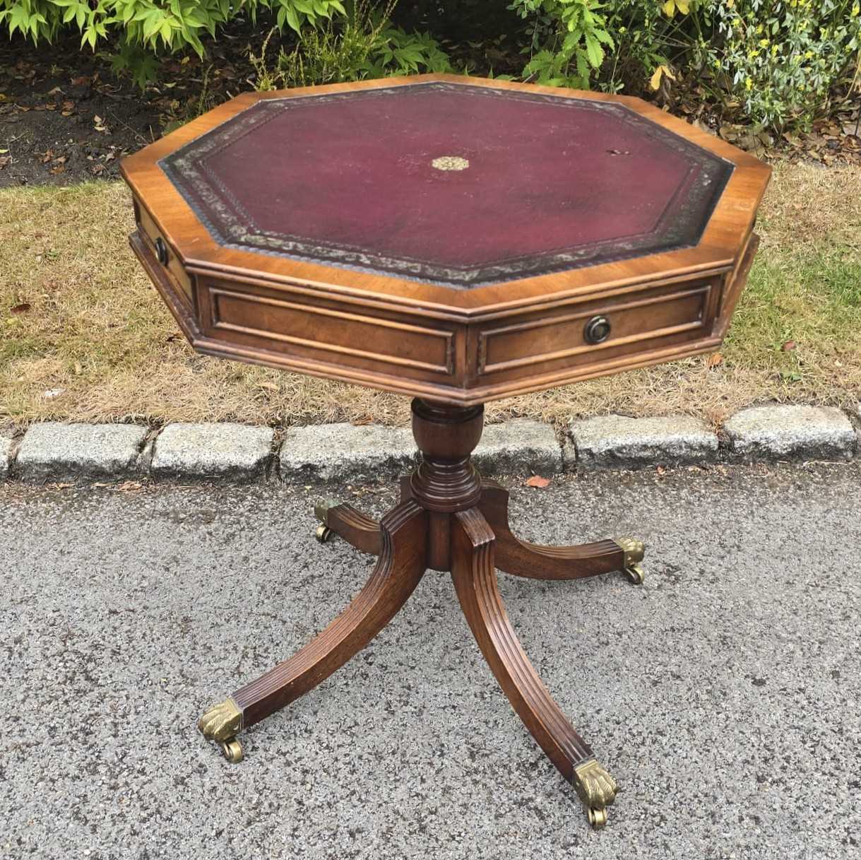 Lot 21 - A small reproduction octagonal top drum table...