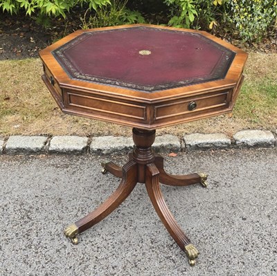 Lot 21 - A small reproduction octagonal top drum table...