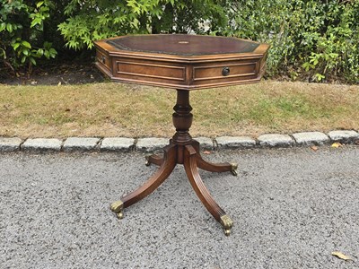 Lot 21 - A small reproduction octagonal top drum table...