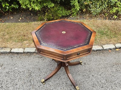 Lot 21 - A small reproduction octagonal top drum table...