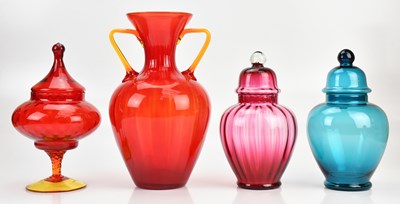 Lot 1430 - A group of three coloured glass lidded jars,...