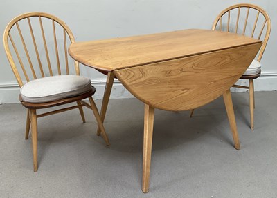 Lot 1003 - ERCOL; a light elm dining table, height 71cm,...