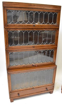 Lot 9 - GLOBE-WERNICKE; a pair of four-tier bookcases,...