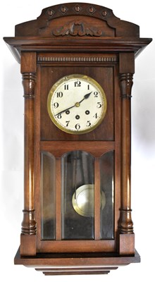 Lot 85 - A 1930s mahogany eight-day chiming wall clock,...