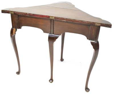 Lot 18 - An early 20th century oak triangular fold-over...
