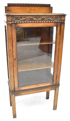 Lot 41 - An early 20th century oak display cabinet with...
