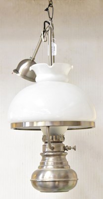 Lot 74 - A modern stainless steel oil lamp style...