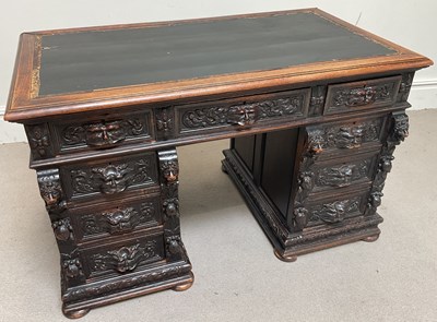 Lot 69 - A Victorian carved oak pedestal desk, with an...