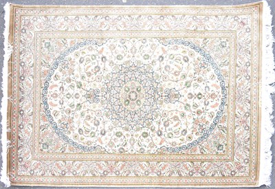 Lot 69 - A Persian silk Qum rug with central floral and...