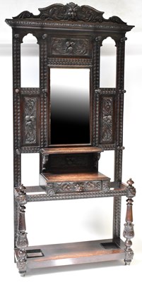 Lot 35 - A Victorian carved oak hall stand, the top...