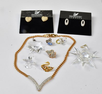Lot 997 - SWAROVSKI; a wishbone-shaped pendant on a gold-...