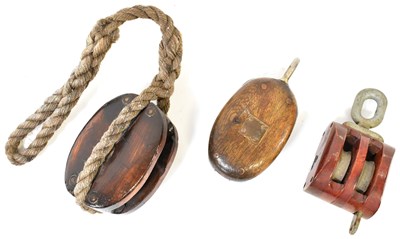 Lot 498 - Three vintage wooden ships' pulleys, with...