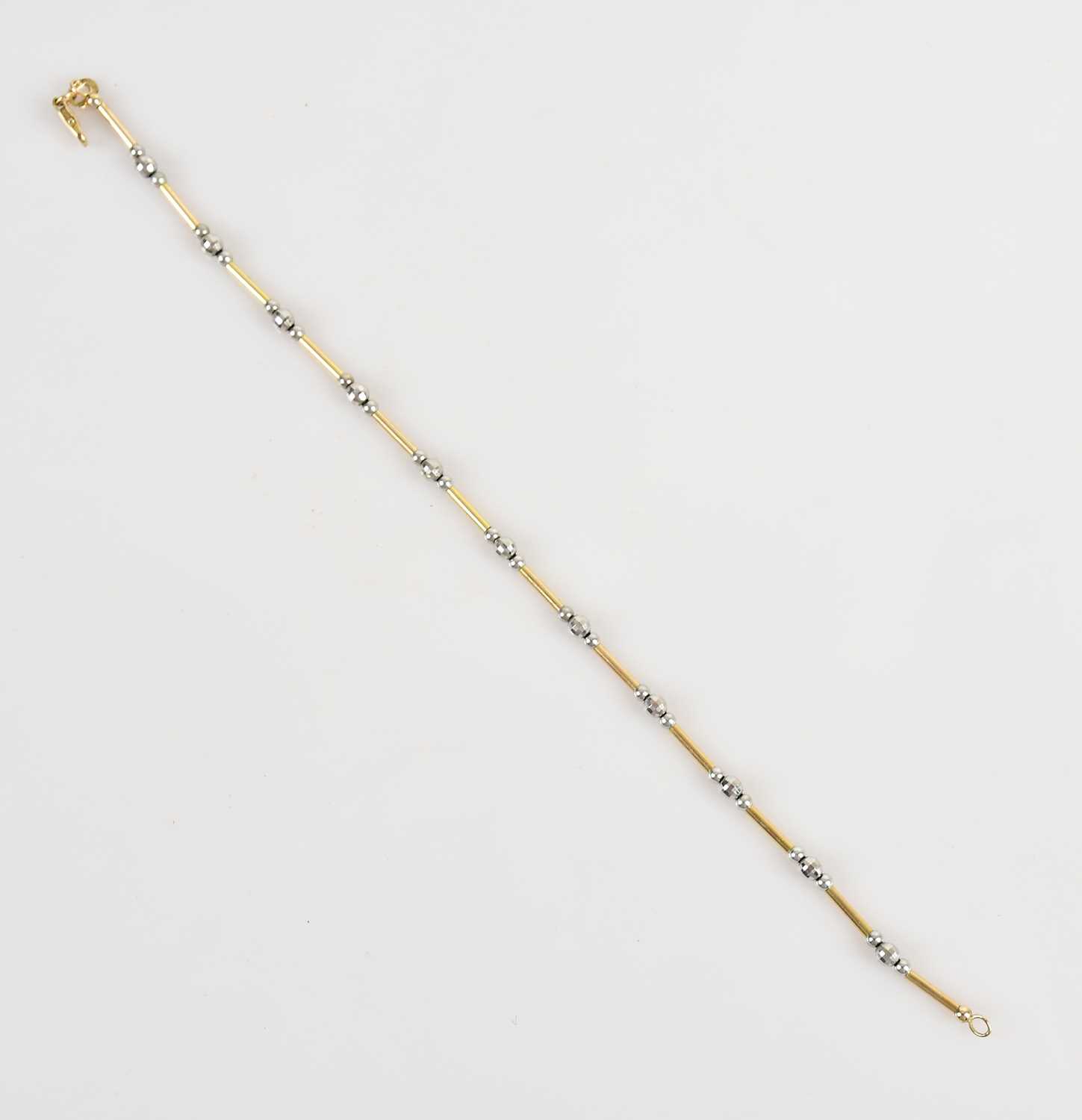 Lot 43 - A 9ct yellow and white gold bracelet, length...