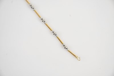 Lot 43 - A 9ct yellow and white gold bracelet, length...