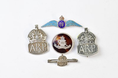 Lot 694 - Three hallmarked silver ARP wardens badges,...