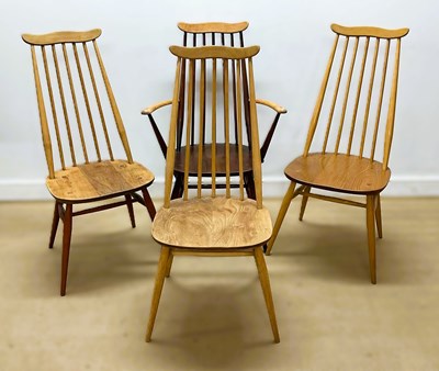 Lot 664 - ERCOL; three dining chairs and one carver from...