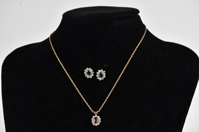 Lot 341 - A 9ct gold cluster pendant on fine link chain,...