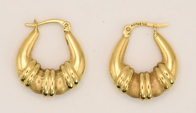 Lot 1506 - A pair of 14ct yellow gold hoop earrings, with...