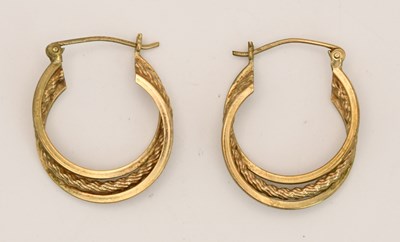 Lot 1509 - A pair of 9ct yellow gold hoop twist earrings,...