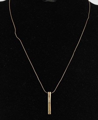 Lot 1475 - A 9ct yellow gold bar rod pendant, set with...