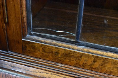 Lot 36 - A 1930s oak bureau bookcase, the leaded glazed...